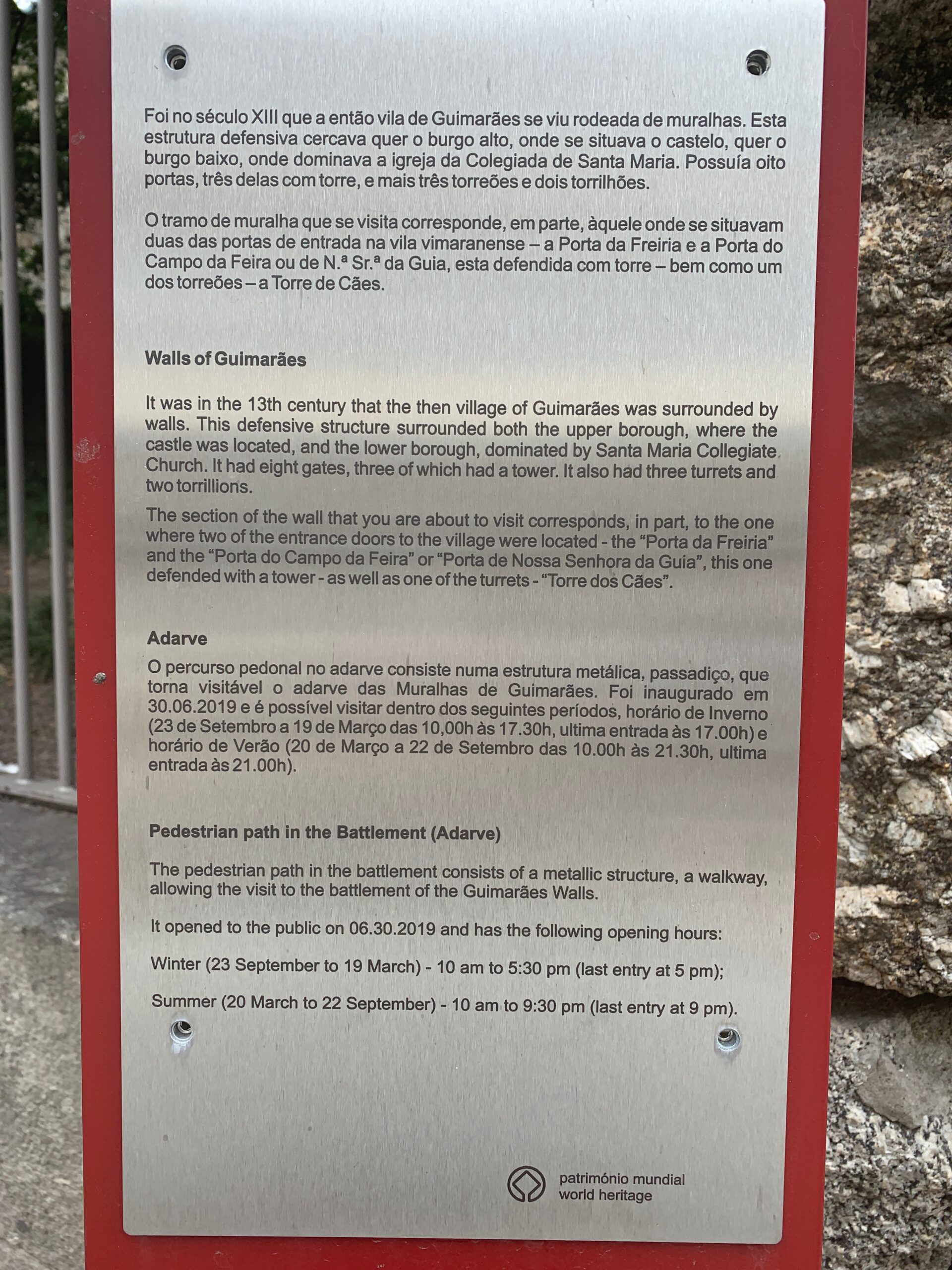 Historical plaque describing the Guimarães medieval city wall.